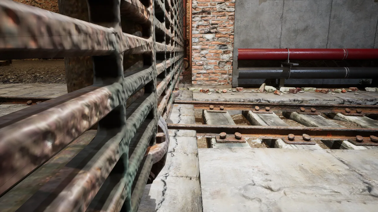 Pipes and a metal gate in the basement tunnel.